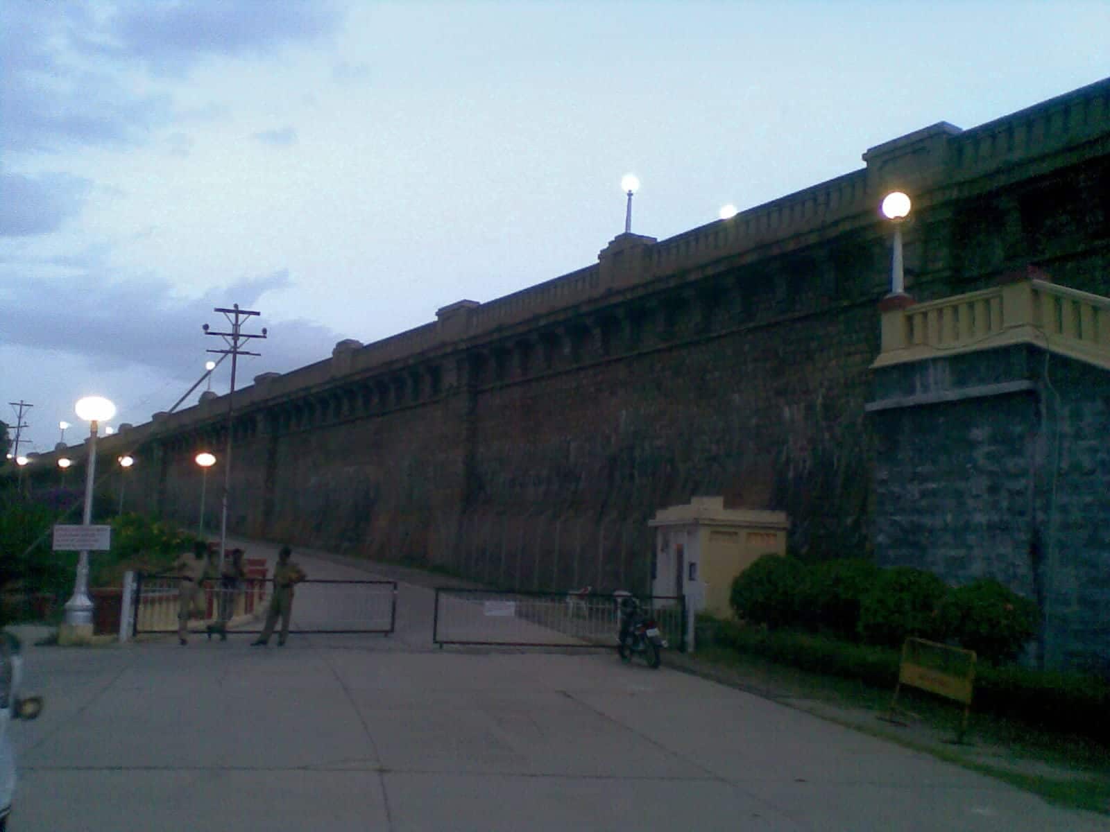 The stone wall of the Krishna Raja Sagara dam at dusk