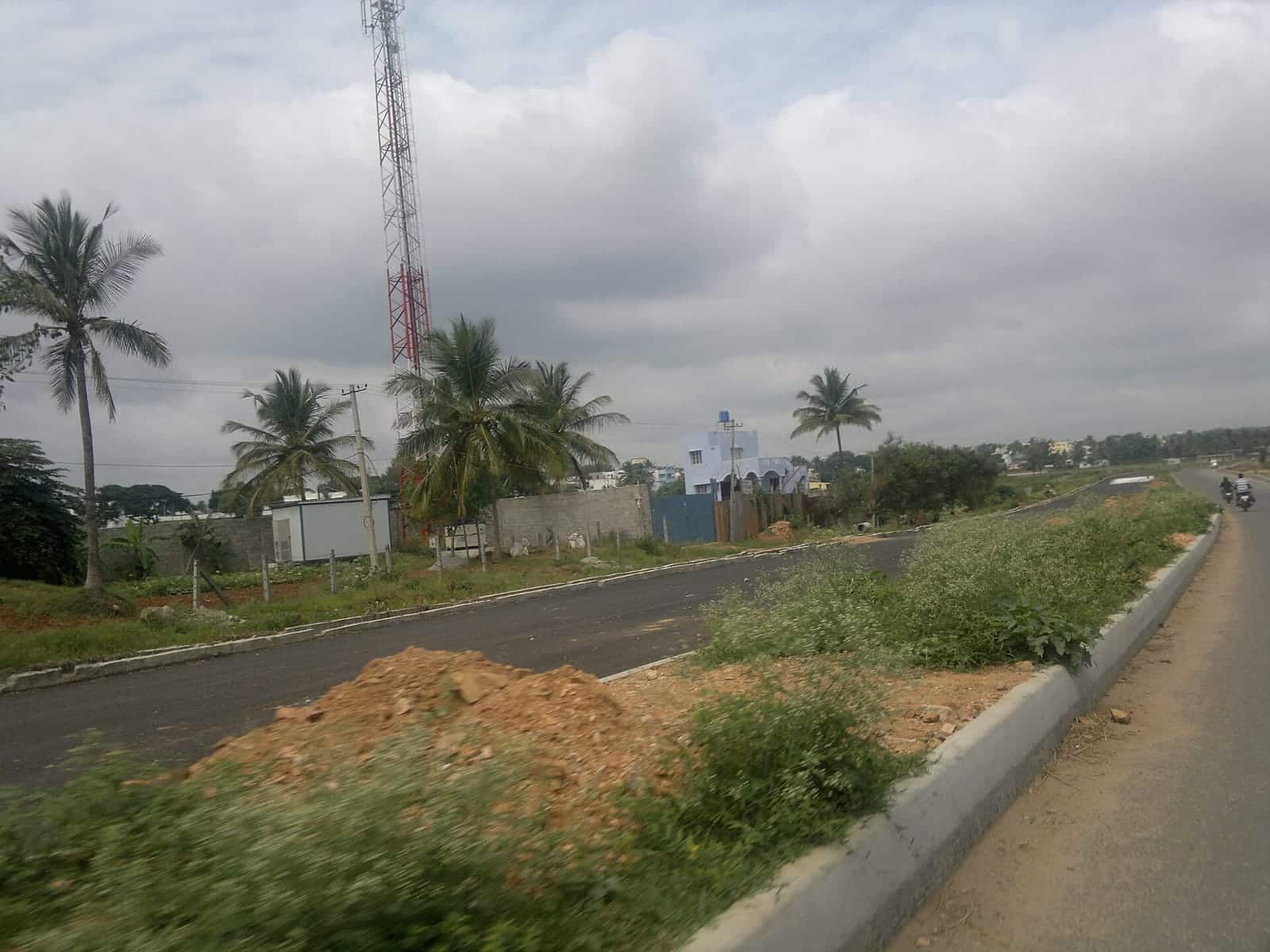 Undeveloped land along a newly laid section of the Mysuru Ring Road