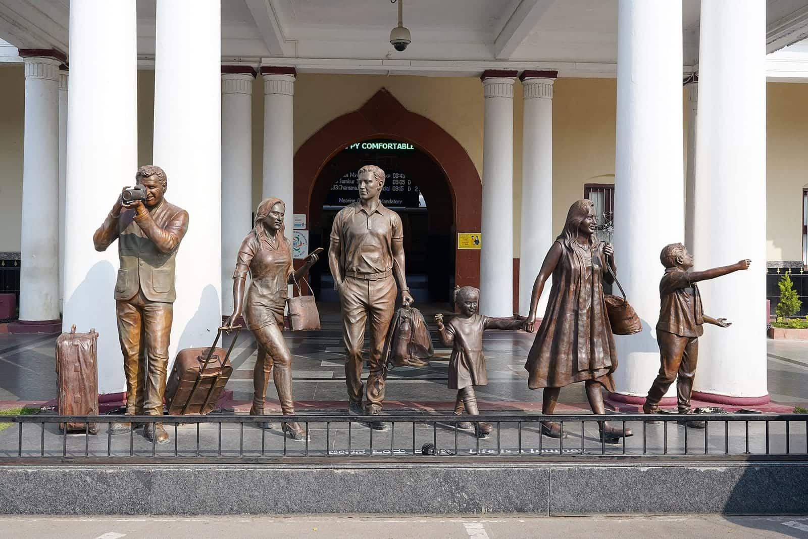 Bronze statues of a travelling family outside Mysuru railway station