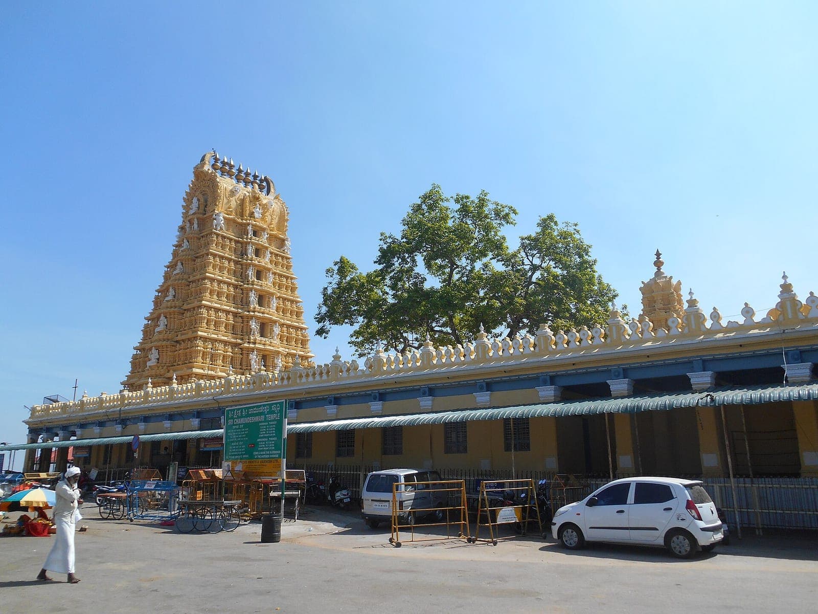 The ornate gopuram of Chamundeshwari Temple under a blue sky