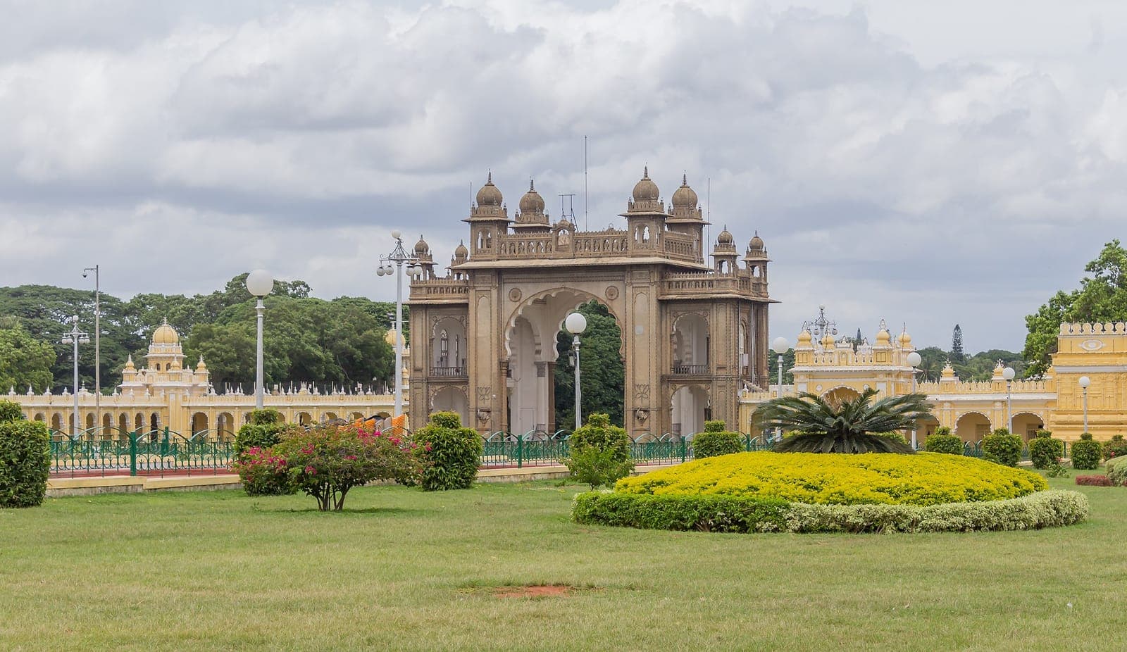 An ornate arched gateway in the grounds of Mysore Palace