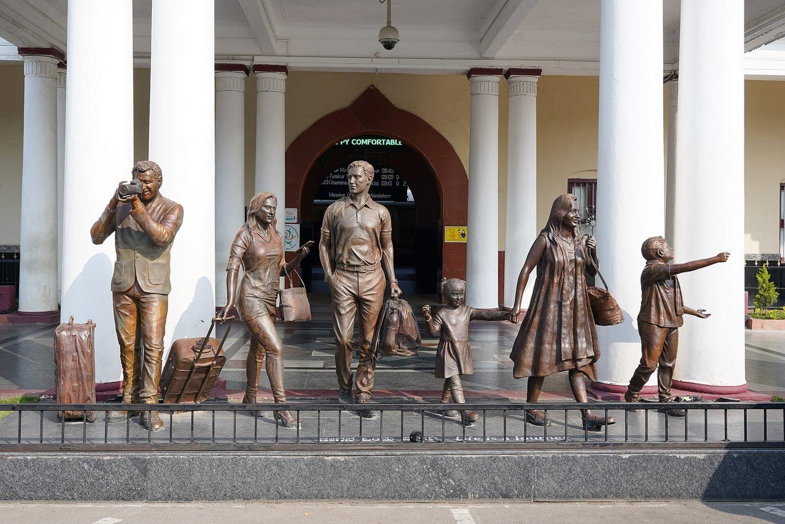 Bronze statues of a travelling family outside Mysuru railway station